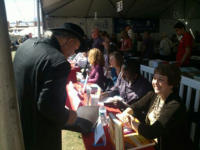 Andrea signing books for customers